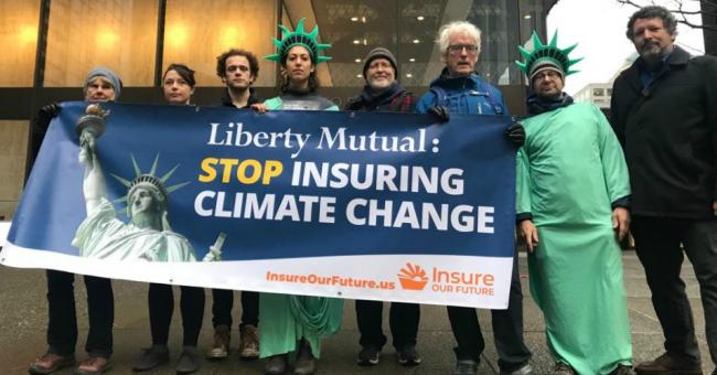Activists with Insure Our Future gathered outside Liberty Mutual's Boston and Seattle offices in December 2019 to demand the insure company "take bold action in the face of the climate emergency and stop insuring fossil fuels." (Photo: Insure Our Future/Twitter)