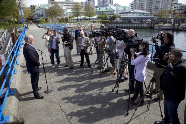 Image: B.C. NDP leader John Horgan speaks to the press in Vancovuer in 2014. Photo: BCNDP via Flickr (CC BY 2.0)