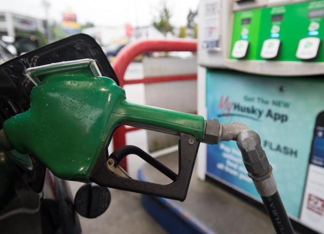 A car is fuelled up at a gas station in Vancouver, on Wednesday, July 17, 2019. File photo by The Canadian Press/Jonathan Hayward