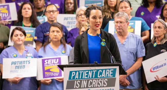 Caroline Lucas, executive director of the Coalition of Kaiser Permanente Unions, along with workers employed by the healthcare giant. 75,000 or more of them could be on strike starting Oct. 4. | Courtesy of Coalition of Kaiser Permanente Unions