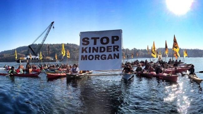 A group of kayaktivists gather before heading to a construction barge in Vancouver harbour near Kinder Morgan's Westridge Marine Terminal on Oct. 28, 2017. File photo by Zack Embree