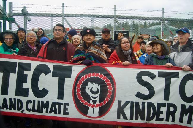 Land defenders and water protectors gather on April 7, 2018 near an exclusion zone on the site of a proposed terminal in Burnaby, B.C., for Kinder Morgan's Trans Mountain expansion. Photo by Dylan S. Waisman