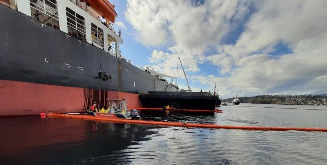 Crews from Western Canada Marine Response Corp. contain a fuel spill on Burrard Inlet, Monday (Feb. 22).Western Canada Marine Response Corporation