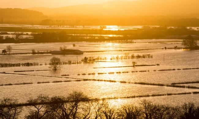 Flood waters in the Lyth Valley in Cumbria after recent storms Photograph: Ashley Cooper/Barcroft Media