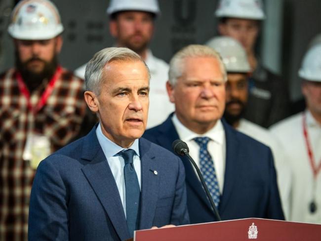 Prime Minister Mark Carney, left, announces $3 billion in funding for a new kind of nuclear reactor with Ontario Premier Doug Ford in Ontario on Oct. 23. Photo by Laura Proctor, the Canadian Press.