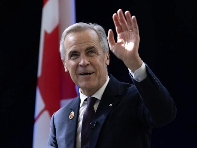 Welcome, brave new robots! Prime Minister Mark Carney ignores the dark side of Big Tech’s AI agenda. Photo by Adrian Wyld, the Canadian Press.