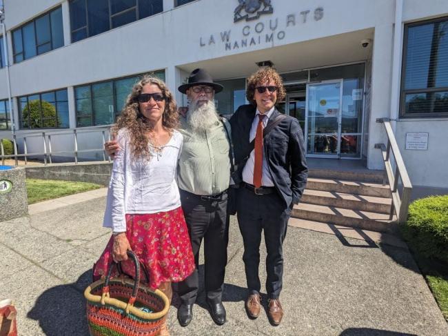 Melanie Murray, left, Howard Breen, centre, and lawyer Joey Doyle, right, at Nanaimo Law Courts last August, where they were allowed to argue a ‘defence of necessity’ for engaging in civil disobedience to protest the climate crisis. Photo by Peter Fairley.