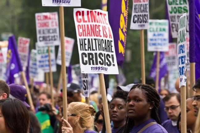 Members of the health care union 1199SEIU at the 2014 People's Climate March in New York City. (maisa_nyc / Flickr)  