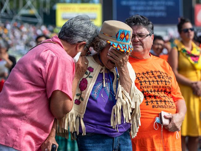 Nancy Saddleman (centre), 82, cries as Pope Francis gives mass in Edmonton, during his papal visit across Canada on Tuesday. Photo by Jason Franson, the Canadian Press.