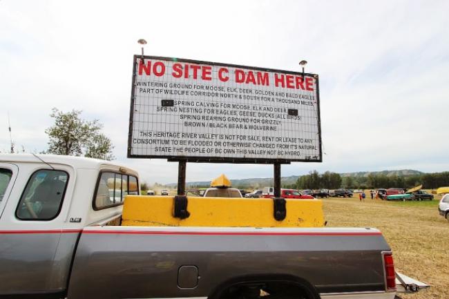 Photo of an anti-Site C Dam sign seen at the annual Paddle for the Peace event. Photo by Wilderness Committee.