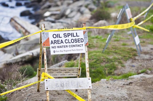 Barricade near an oil spill. CC Flickr by Thomas Hawk.