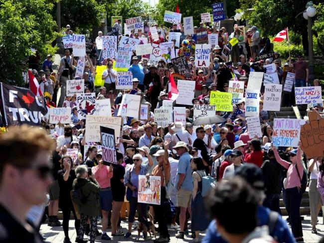 Canadians rally against actions by US President Donald Trump, near the US Embassy in Ottawa on June 14, 2025. Photo by Justin Tang, the Canadian Press.