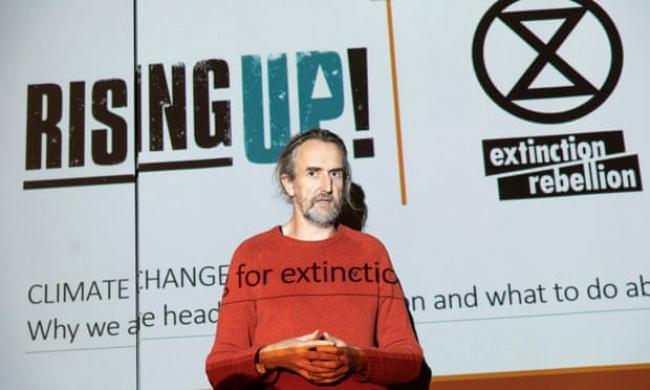  Roger Hallam, co-founder of Extinction Rebellion, speaking at a Rising Up conference. Photograph: David Levene for the Guardian