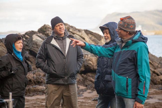 Dimitry Lisitsyn (R in black and teal coat) visiting Lelu Island. Photo courtesy of Skeena Wild Conservation Trust