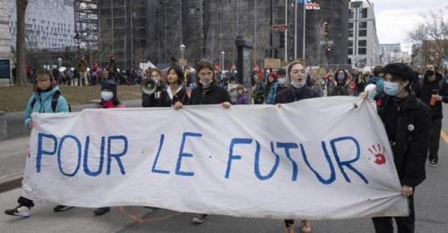 People mark Earth Day with a march, Friday, April 22, 2022 in Montreal. PHOTO BY RYAN REMIORZ /The Canadian Press