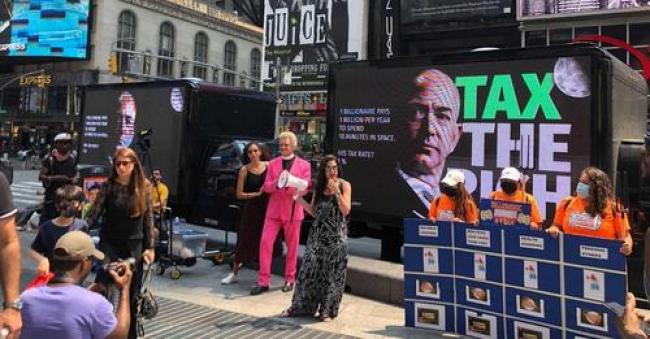 Demonstrators gathered in Times Square in New York City on July 27, 2021 to participate in a "Tax the Rich Game Show" and demand higher taxes on big corporations and wealthy people. (Photo: Tax March)