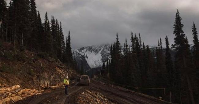 A worker stands on a newly cut access road for the Coastal GasLink pipeline near Houston, B.C., in 2019. Since then, the company has faced 11 non-compliance orders from the environmental assessment office for contravening its operating permit. Photo: Amber Bracken / The Narwhal