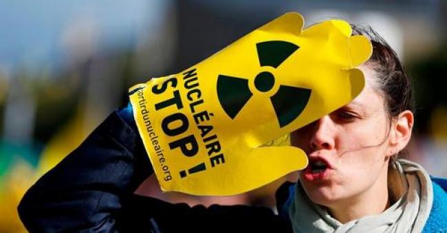 A protestor gestures during an anti-nuclear demonstration on October 1, 2016 in Siouville-Hague, northwestern France. (Photo: Charly Triballeau/AFP via Getty Images)