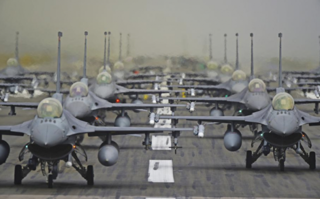 American fighter planes in formation at the Ramstein Air Base in Germany. It serves as the headquarters for the United States Air Forces in Europe – Air Forces Africa (USAFE-AFAFRICA) and NATO Allied Air Command (AIRCOM). Photo by Roland Balik/US Air Force/Flickr.