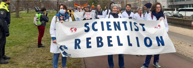 Scientists in the Netherlands blocked an entrance to the Ministry of Economic Affairs and Climate Policy in The Hague on Wednesday, April 6, 2022. (Photo: Scientist Rebellion / @ScientistRebel1)