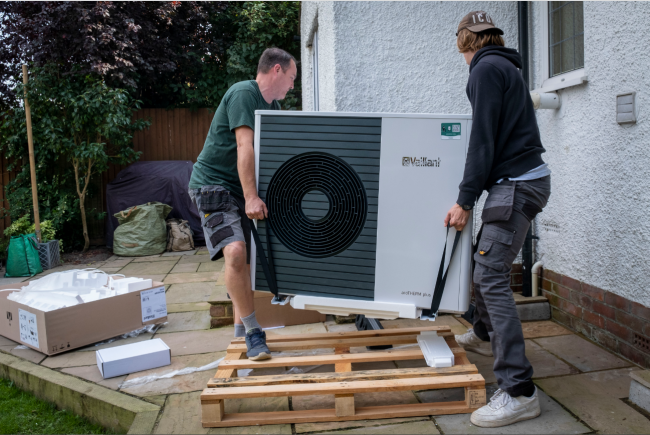Installing heat pump - This Machine Fights Fascism (an air source heat pump being installed last September in a house built in the 1930s in Folkestone, UK).