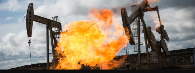 A gas flare is seen at an oil well site outside Williston, North Dakota. (Photo: Andrew Burton via Getty Images)