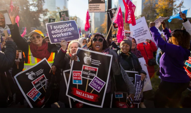 CUPE members and supporters rallied outside of Queen's Park in Toronto on the first day of a strike earlier this month that closed schools in boards across the province. (Carlos Osorio/CBC)