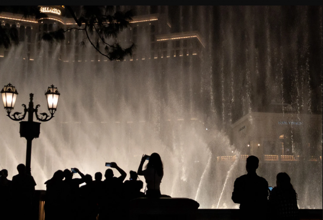 Crowds take photos at the Bellagio Fountain in Las Vegas. The fountain is fed by a private well from a now-defunct golf course, not by the Colorado River. Photo by Jonathan Cutrer / Flickr