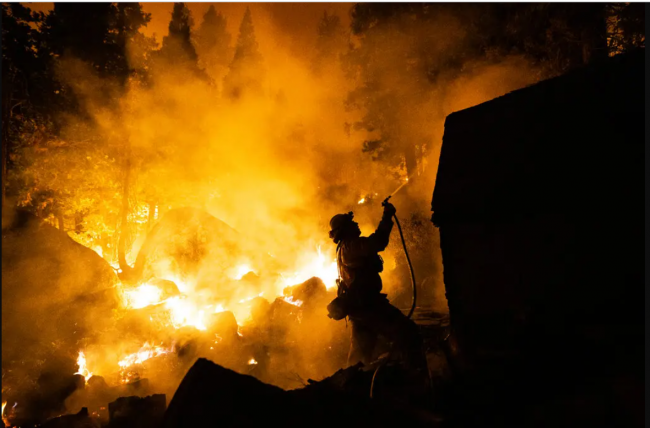 A firefighter tried to save a home in Meyers, Calif., in 2021. Credit...Max Whittaker for The New York Times