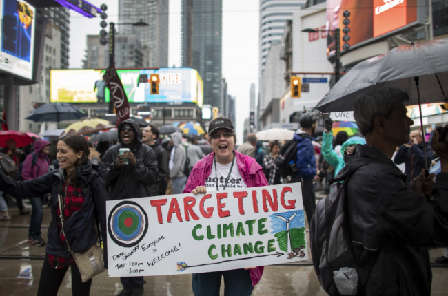 Protesters, joined by faith leaders and members of Extinction Rebellion Toronto, take over an intersection in downtown Toronto as part of a demonstration declaring a climate crisis, June 10, 2019. Photo by Nick Iwanyshyn / Canada's National Observer