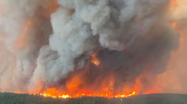 This photo provided by the Manitoba government shows wildfires in Sherridon, Man., on Tuesday, May 27, 2025. (Government of Manitoba)