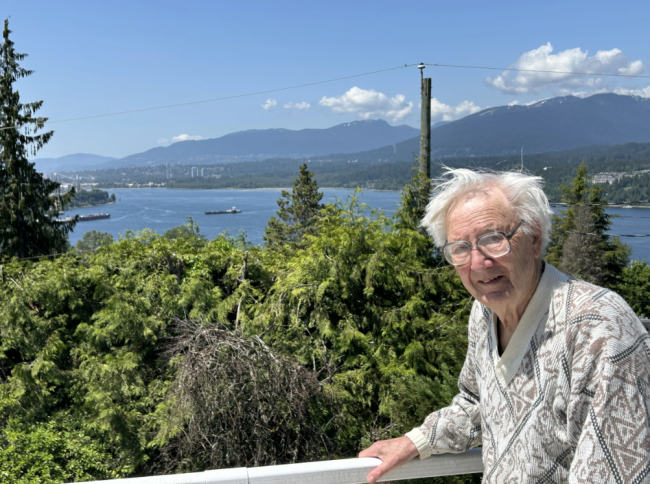 David Huntley on his home patio overlooking Burrard Inlet, where Aframax tankers pass by almost every day to load up on bitumen from the Trans Mountain pipeline's terminus at Westridge Marine Terminal, just out of sight below the treeline. Photo by Arno Kopecky/Canada's National Observer