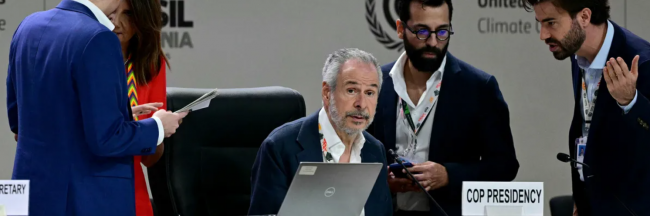 COP30 President Andre Correa do Lago listens to an adviser upon arrival for a plenary session in Belém, Brazil on November 21, 2025. (Photo by Pablo Porciuncula/AFP via Getty Images)