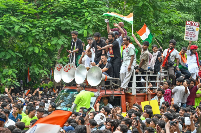 Abhijeet Dipke, founder of the Cockroach Janta Party, speaks in a protest march towards Parliament from Jantar Mantar on July 20, 2026 in New Delhi, India. Photo by Sanchit Khanna/Hindustan Times via Getty Images.