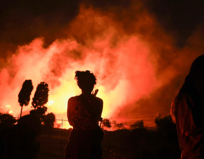 Firefighters battle wildfire near Preveli on the island of Crete, Greece, 30 July 2026. Photograph: Costas Baltas/Anadolu/Getty Images