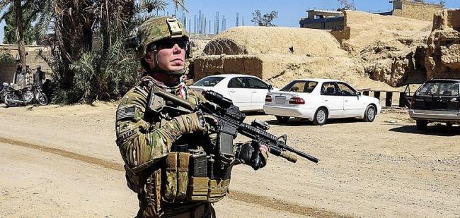 To many, the American war in Afghanistan—which on Oct. 7 will enter its 19th year—is a prime symptom of the disease of empire. Above, a U.S. Army National Guard staff sergeant in a battle zone there in 2012. (Lt. Benjamin Addison / U.S. Army)