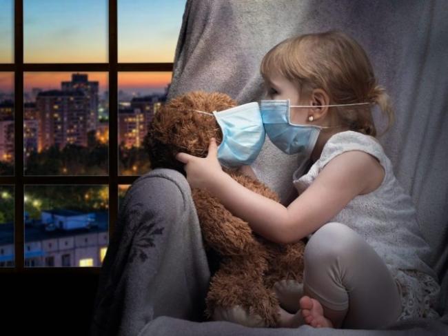 child and stuffy with face mask - Shutterstock