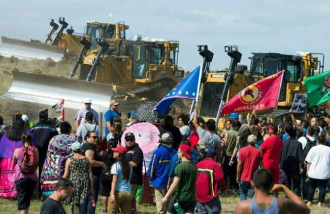 Members of the Standing Rock Sioux tribe and their supporters opposed to the Dakota Access Pipeline protesting at the site of construction near Cannon Ball, North Dakota, U.S., on September 3. Photo:Robyn Beck/AFP