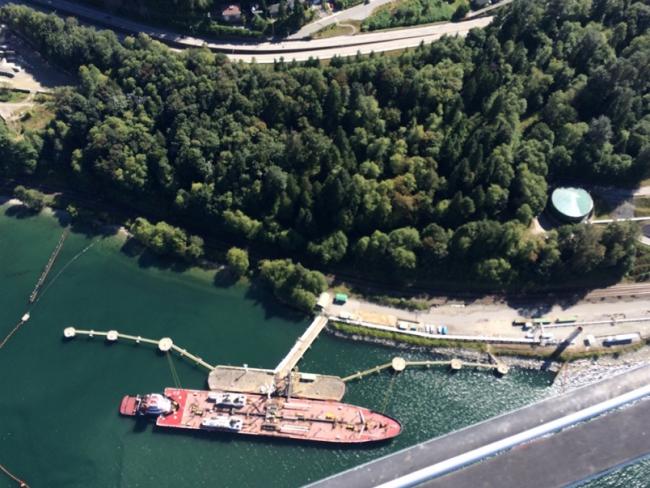 A tanker fills up at the Kinder Morgan Westridge Marine Terminal on the Burrard Inlet. Photograph By NOW FILES