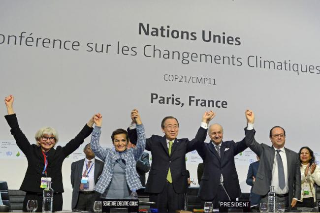 Teaser photo credit: Plenary session of the COP21 adopting the Paris Agreement in 2015. By UNclimatechange from Bonn, Germany – they did it!, CC BY 2.0, https://commons.wikimedia.org/w/index.php?curid=81571199