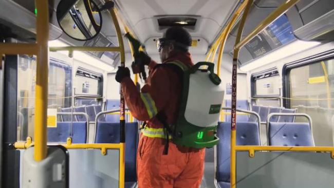  TransLink crews spray a bus with disinfectant. The transit authority says buses are now getting a weekly spray, along with regular cleaning. . TransLink