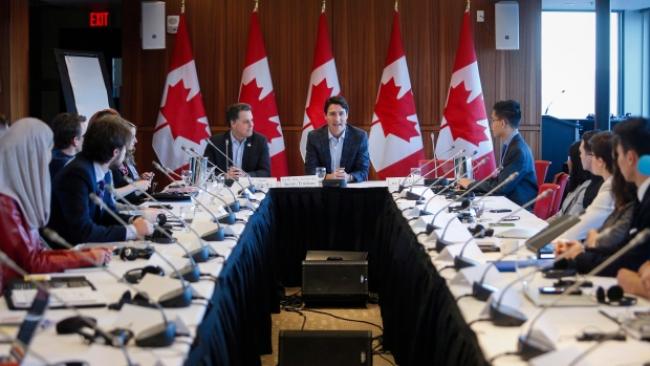 Prime Minister Justin Trudeau, centre, attends a meeting of the Prime Minister's Youth Council in Calgary on Wednesday, Jan. 25, 2017.THE CANADIAN PRESS/Jeff McIntosh