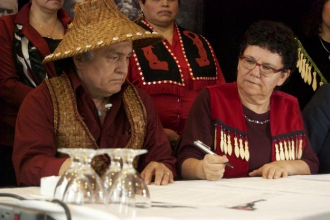 Tsleil-Waututh First Nation Chief Maureen Thomas signs the International Treaty to Protect the Sacred. Photo by Erin Flegg.