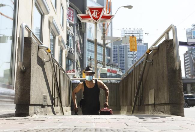 masked man leaving TTC subway