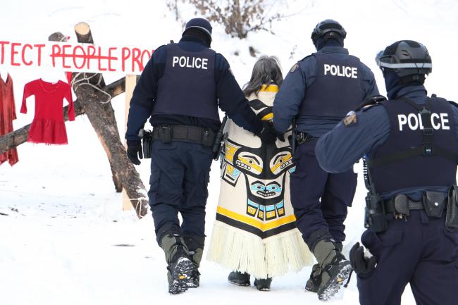Freda Huson is arrested in February 2020 at the end of a long standoff between RCMP and Wet’suwet’en land defenders in northern BC. Photo by Amanda Follett Hosgood.