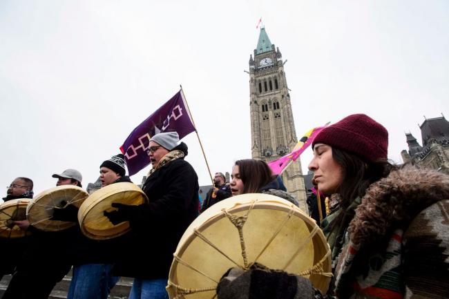 Protesters voice opposition to pipelines during a rally on Parliament Hill in Ottawa on Jan. 8. Dozens of rallies are planned in British Columbia, across Canada and as far away as Europe to support pipeline protesters arrested in northwestern British Columbia. (Sean Kilpatrick/Canadian Press/AP)