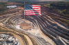 Open pit mine and US flag
