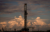 A drilling rig operates as the sun sets on July 6, 2022, in Pecos, Texas. JON SHAPLEY / HOUSTON CHRONICLE VIA GETTY IMAGES