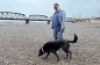 George Soares says being able to walk his dog across what is normally a riverbed is 'sad and great at the same time,' providing new areas to explore while prompting concerns about the province's ongoing drought. (Andrew Kurjata/CBC)