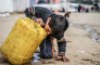 A child drinks from a plastic container in Gaza. More than 2 billion people lack access to safe drinking water. Photograph: Abed Zagout/Anadolu via Getty Images